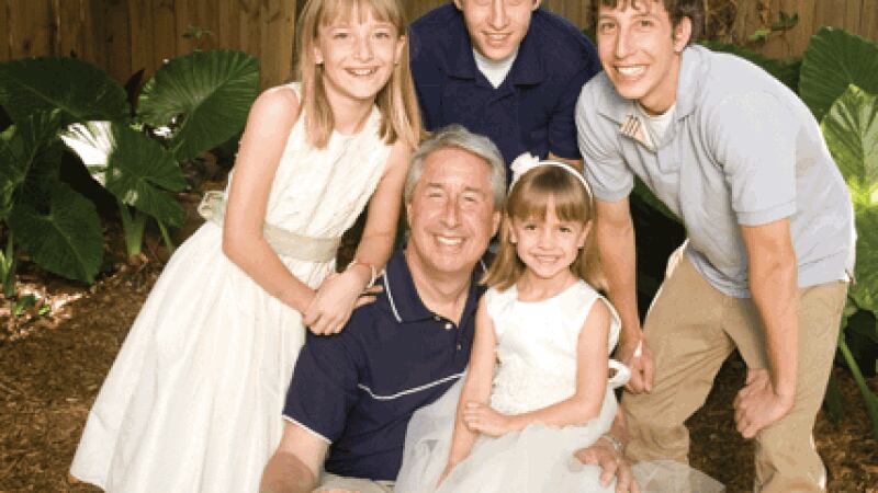 Arnie Fielkow is pictured with his sons and the two girls he and his wife adopted from Ukraine.