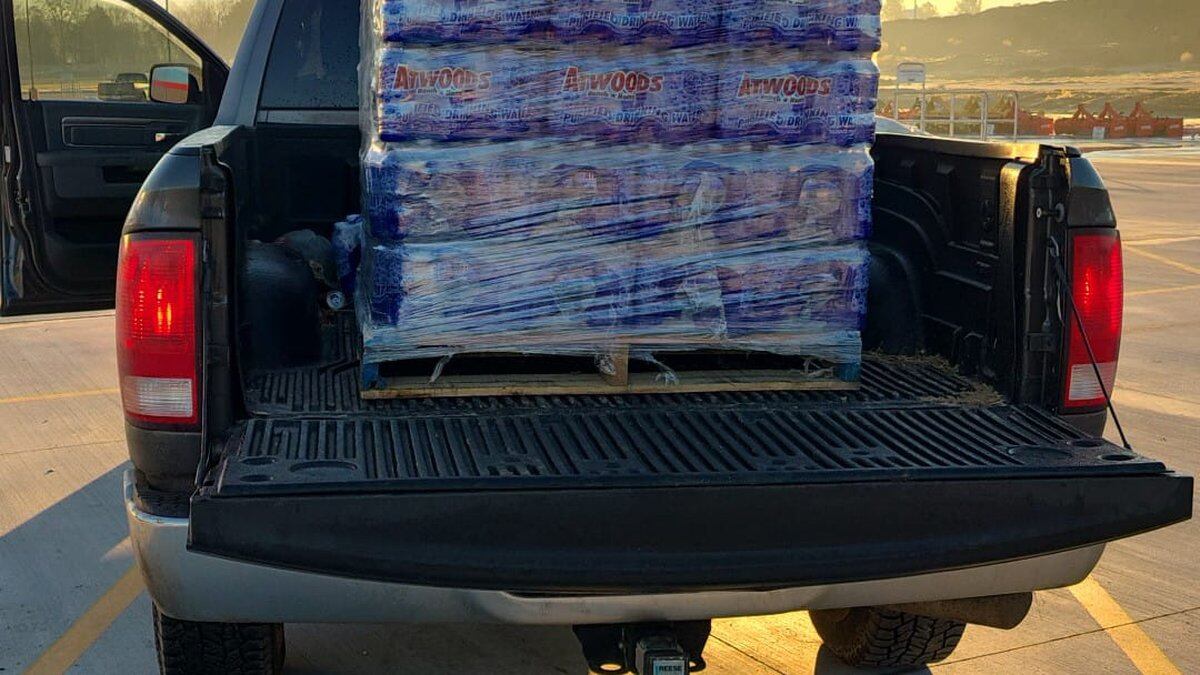 Nolan Williams loads up his truck for a day's worth of bottle water deliveries.