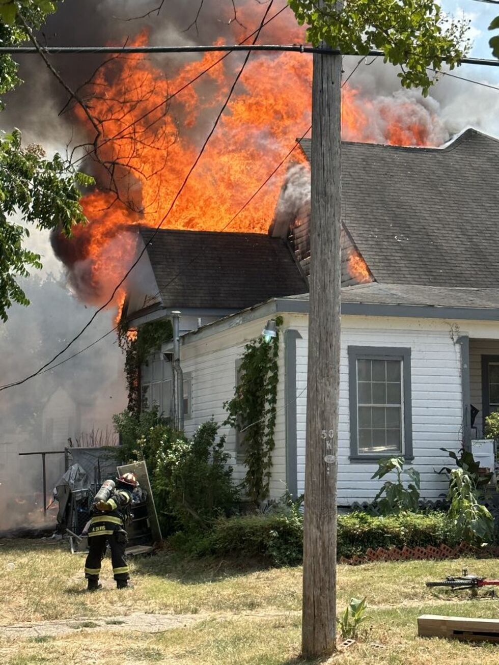 Fire heavily damaged a two-story, wood-frame house on Vine Street between Highland Avenue and...
