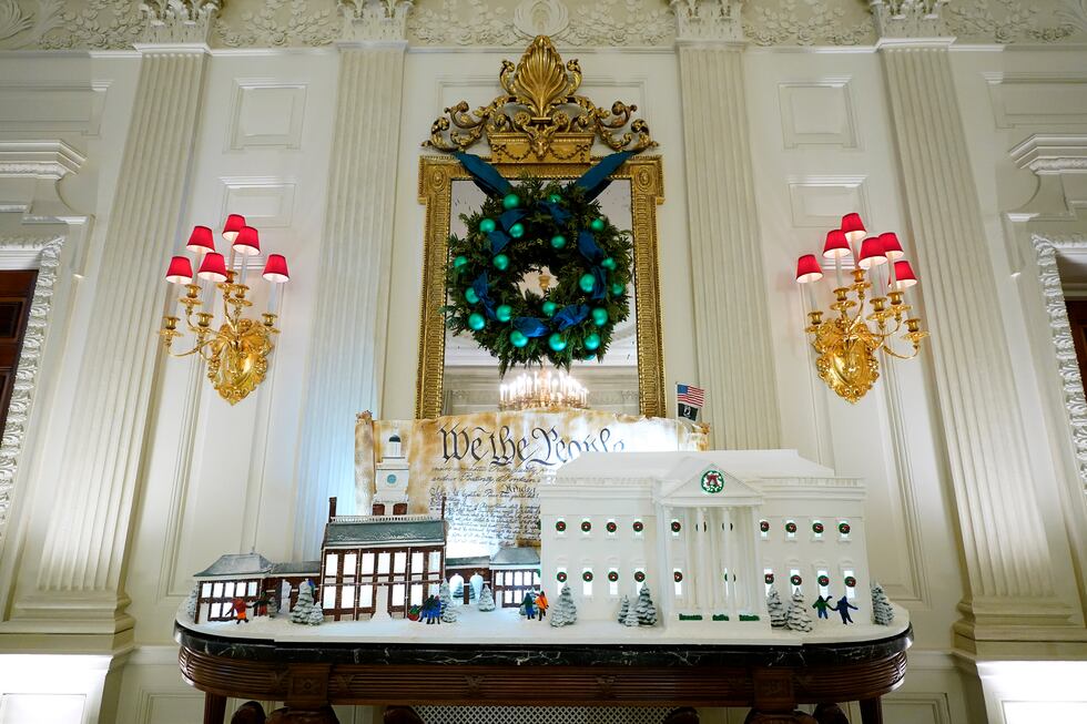 A sugar cookie replica of Independence Hall and a gingerbread replica of the White House are...