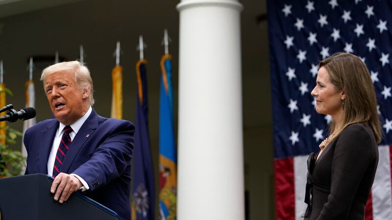 Judge Amy Coney Barrett listens as President Donald Trump announces Barrett as his nominee to...