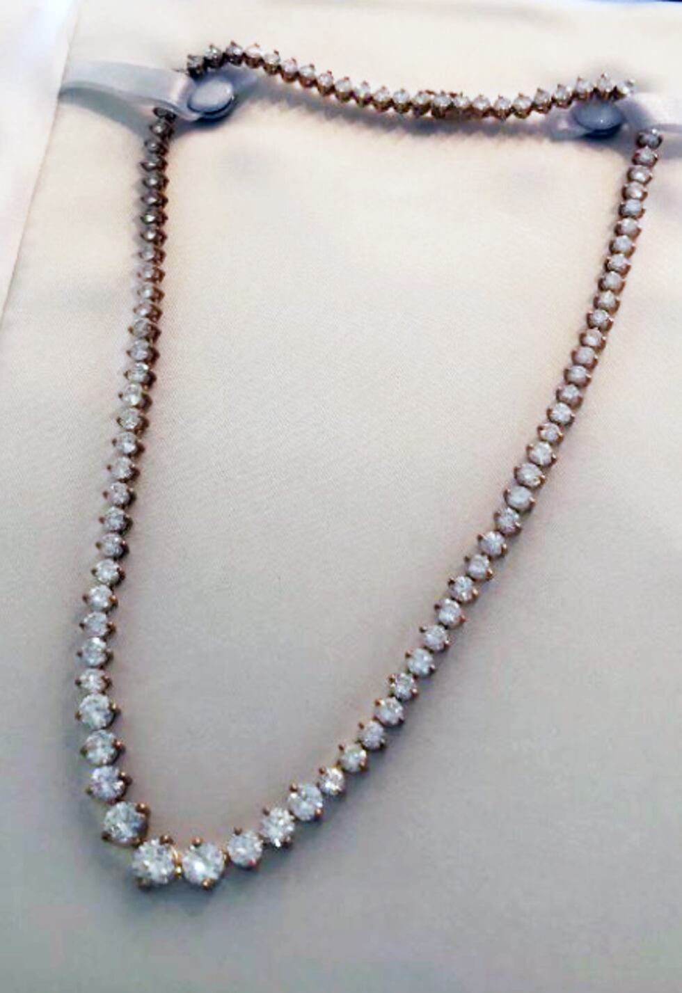 Lady’s 18K gold and diamond straight line necklace with 95 graduated full cut brilliant...