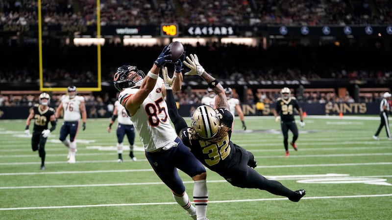 Chicago Bears tight end Cole Kmet (85) makes a touchdown catch over Saints safety Tyrann...
