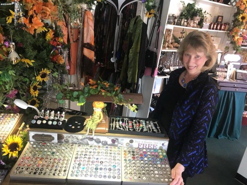 Owner of Enchanted Garden showing off display. (Source: Eric Pointer/ KSLA News 12)