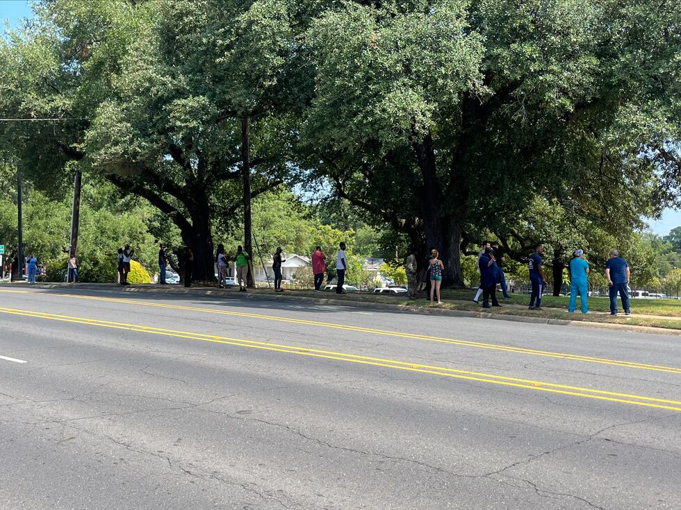 People standing outside C.E. Byrd High School after police received reports of a potentially...
