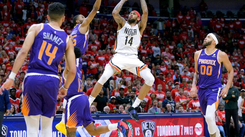New Orleans Pelicans forward Brandon Ingram (14) shoots against Phoenix Suns forward Mikal...