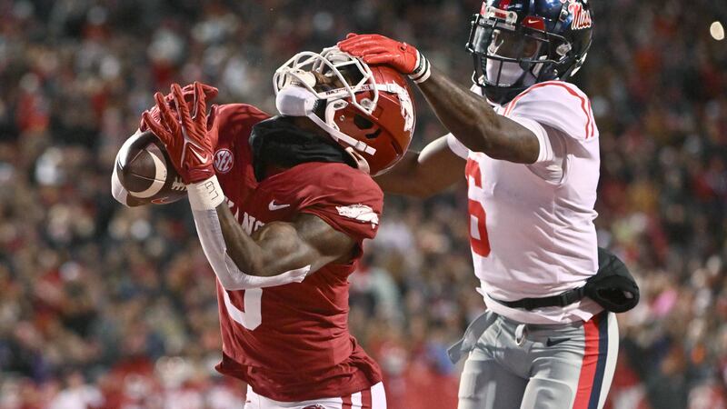 Arkansas wide receiver Matt Landers (3) makes a touchdown catch in front of Mississippi...