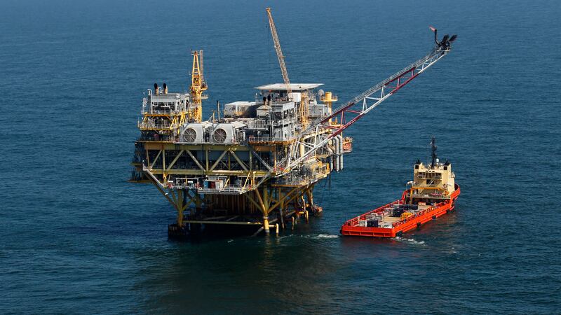 This Sunday, April 10, 2011 picture shows a rig and supply vessel in the Gulf of Mexico, off...