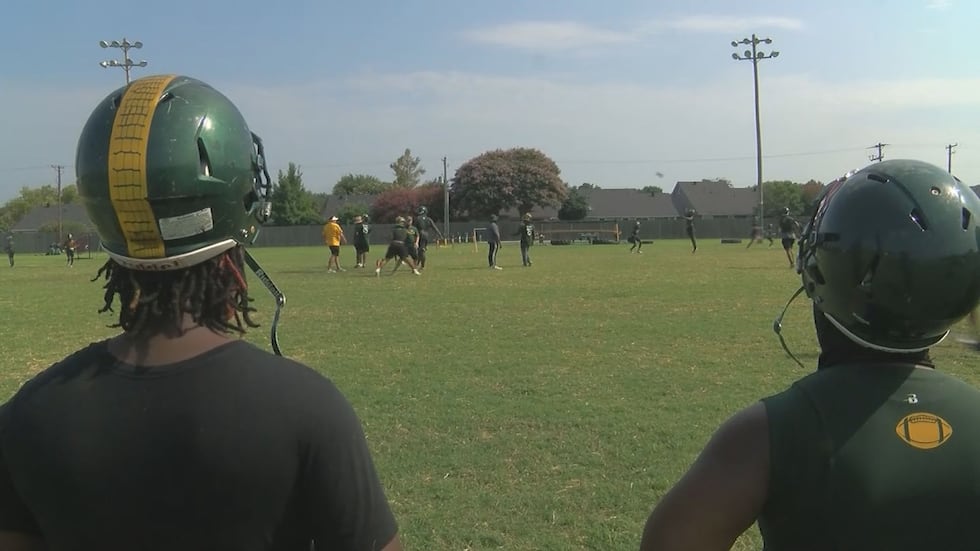 Players watching practice at Captain Shreve High School
