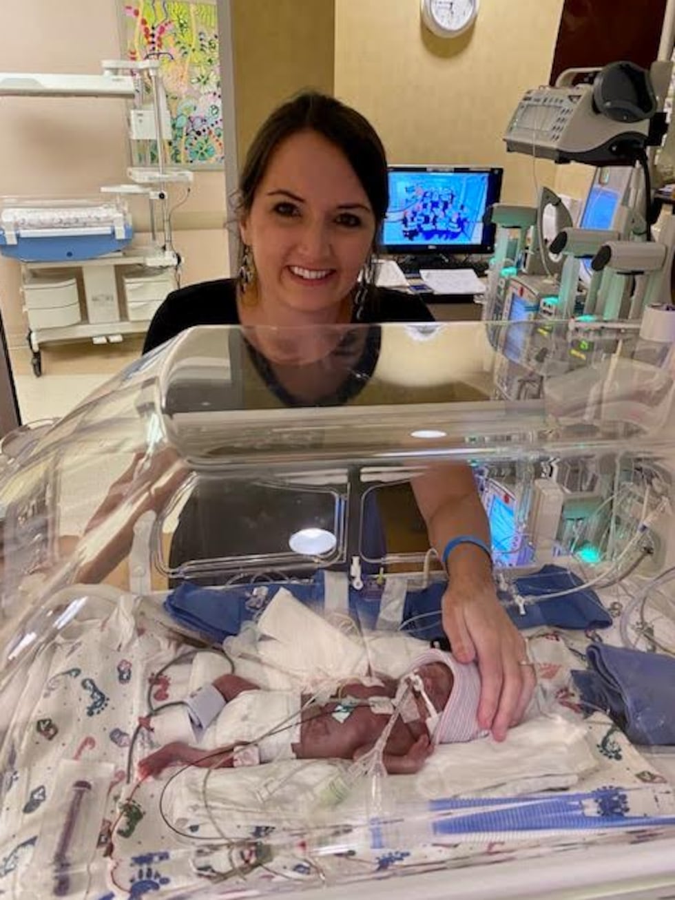 Heather Bourgeois visits her newborn, Hadley, inside a local hospital's NICU.