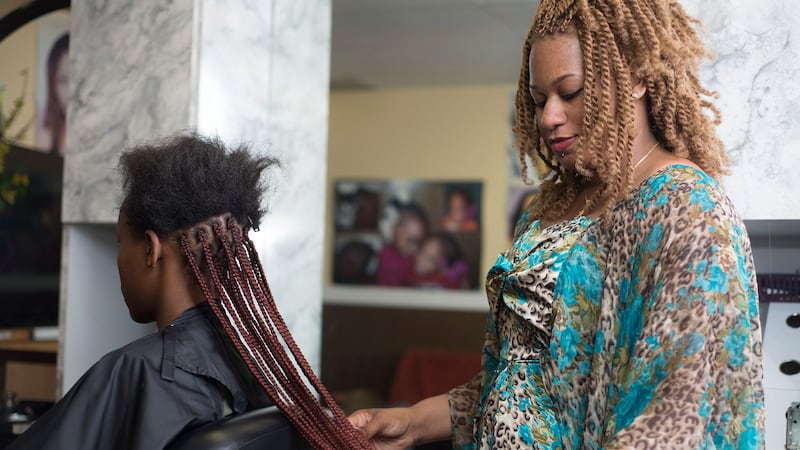 Salamata “Sally” Sylla, originally from Senegal, operates a salon in Kent, Wash., where the...